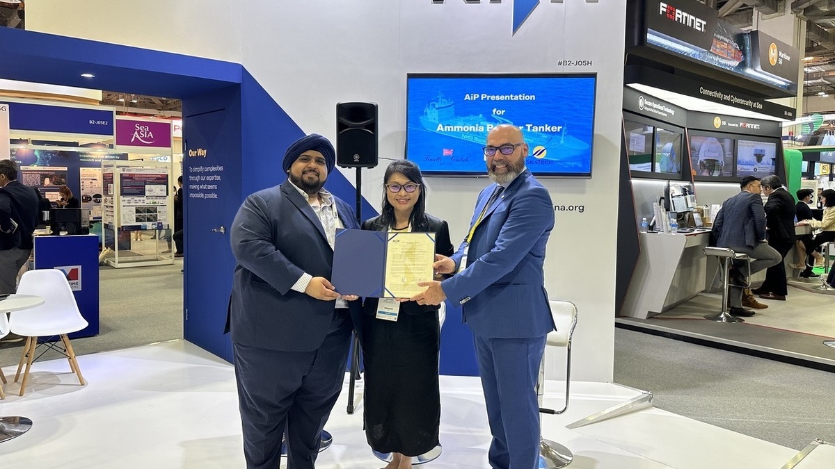 From left to right- Prabjot Singh Chopra, VP Technology - SeaTech Solutions International (S) Pte Ltd. and Diana Mok, Managing Director - Fratelli Cosulich Bunkers (S) Pte Ltd - Simone Manca, Marine A.jpg