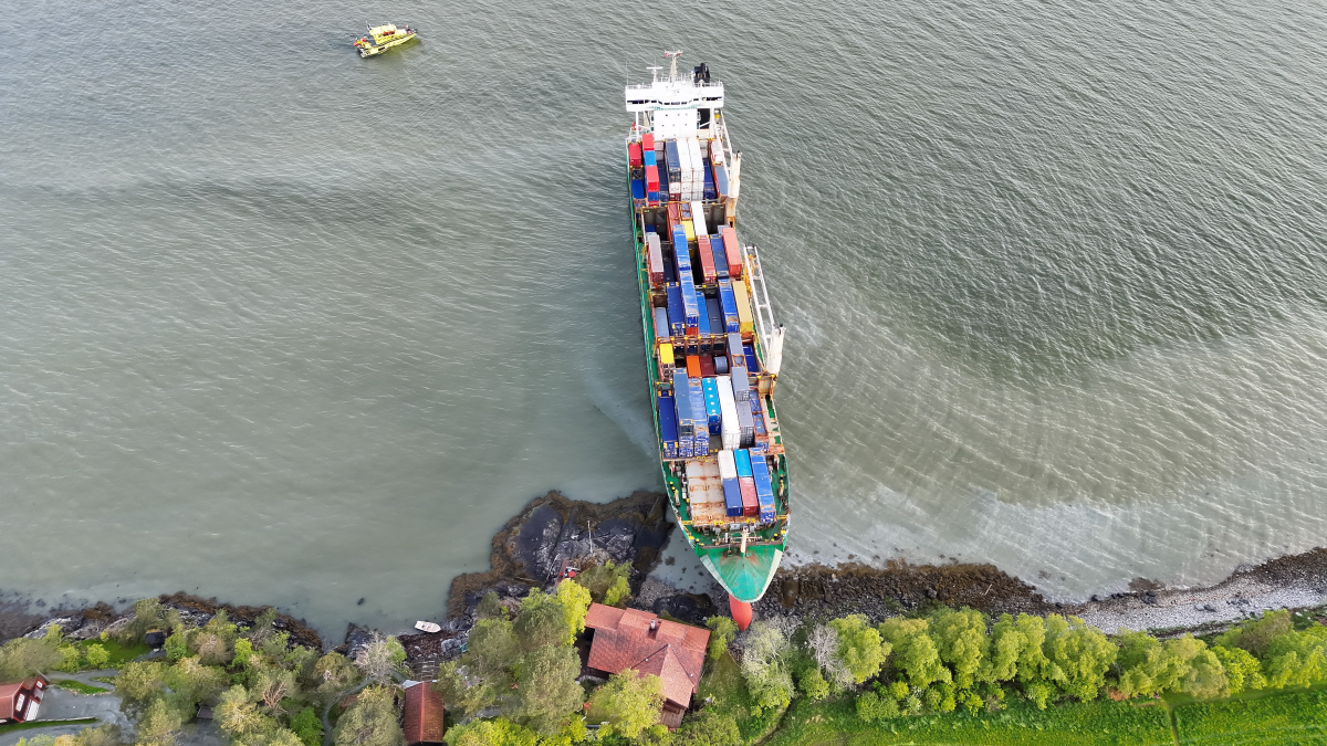 Video: container ship runs aground next to a house in Norway, duty officer questioned