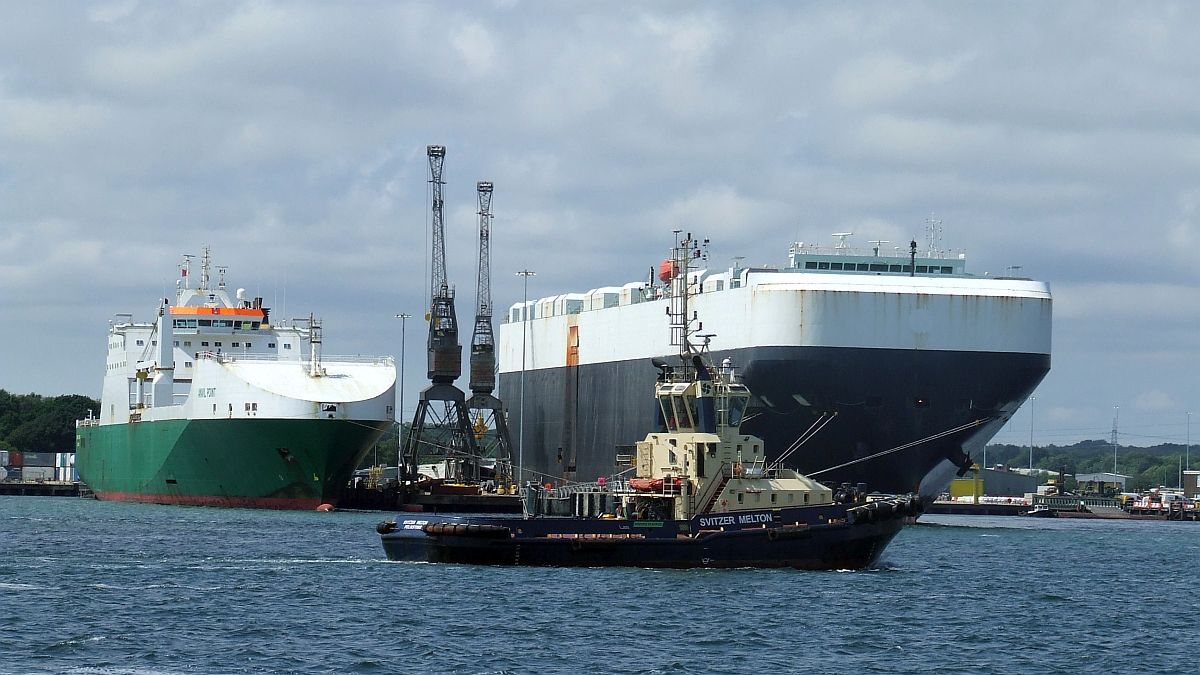 Southampton port car carrier and general cargo plus tug