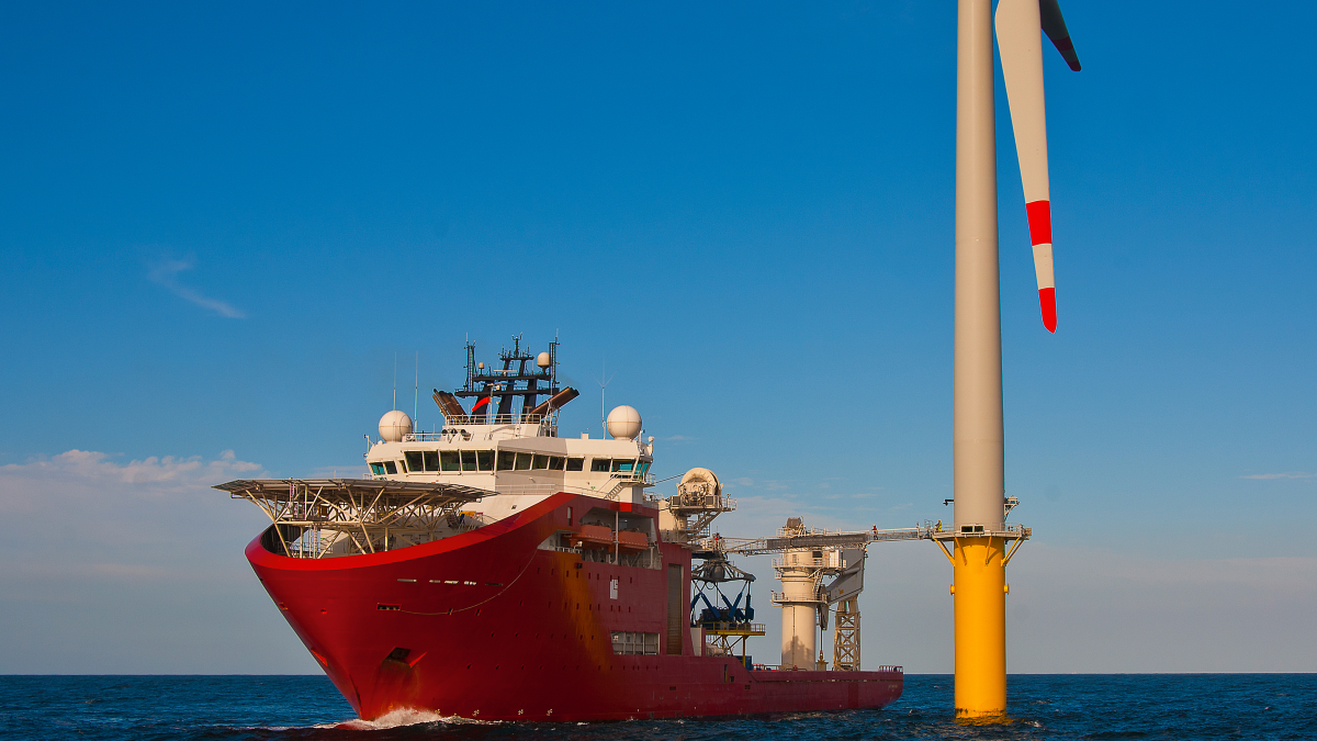 Service vessel with walk to work gangway deployed to offshore wind turbine